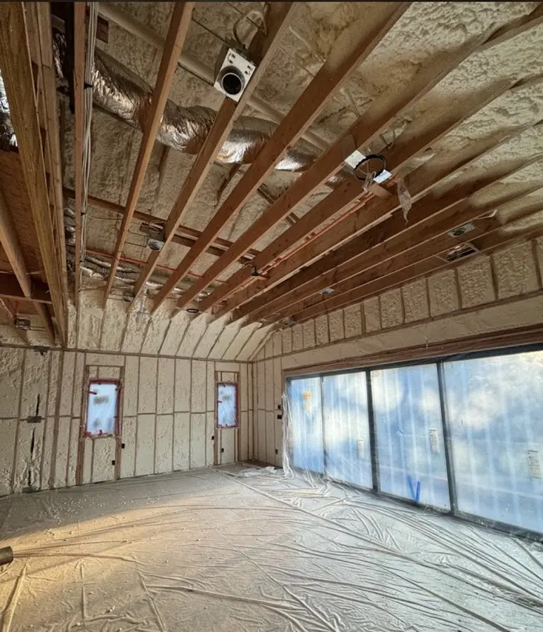 Interior walls and ceiling insulated with spray foam during new construction in Benner